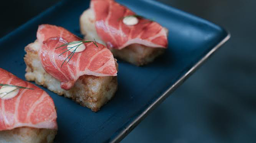 Toro sashimi with crispy rice.